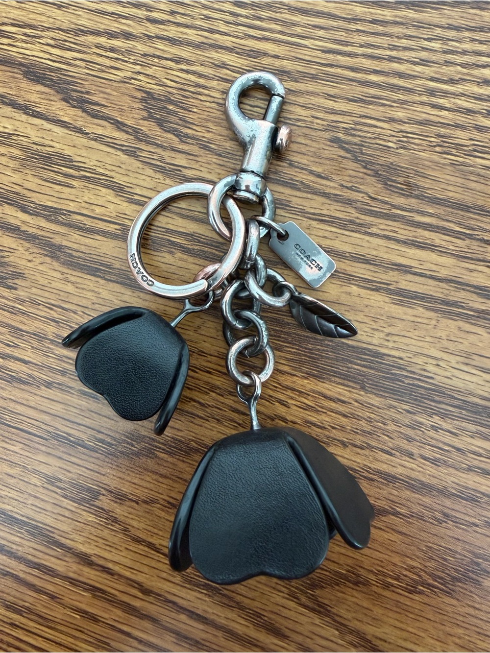 Coach black leather tea rose charm